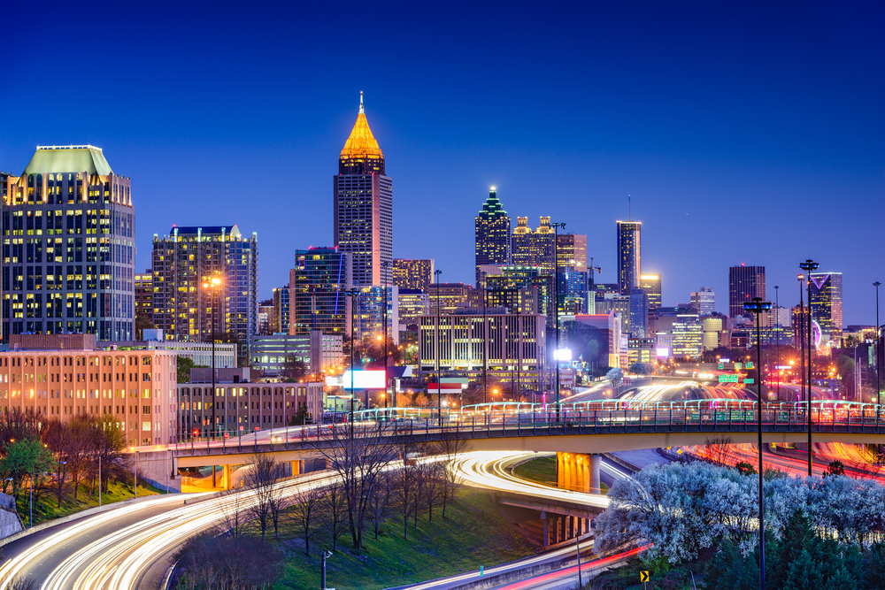 The sparkling city skyline at dusk is seen in a long exposure shot of one of the most romantic hotels in Atlanta, Georgia.